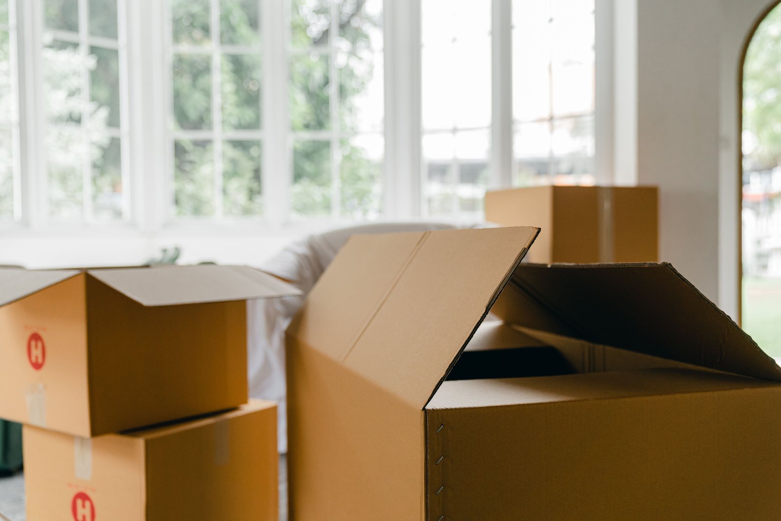 Cardboard moving boxes in a bright room